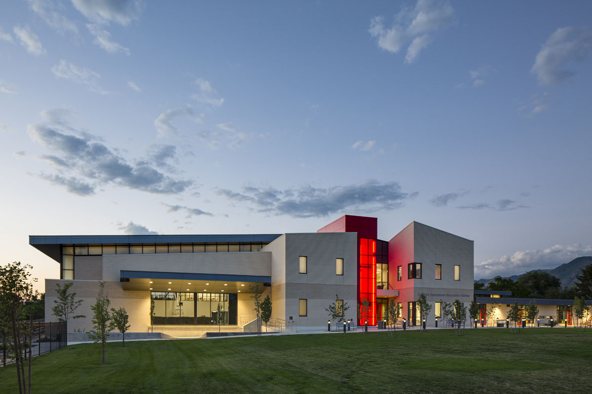 The Utah Schools for the Deaf and the Blind building with glowing red staircase.